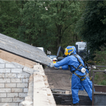 Puget Sound Abatement employees working on a roof